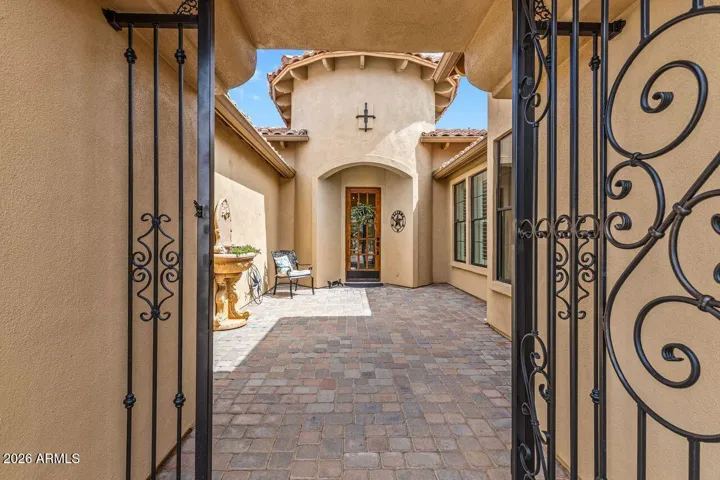 Enjoy the relaxing private courtyard with Old World iron gate.