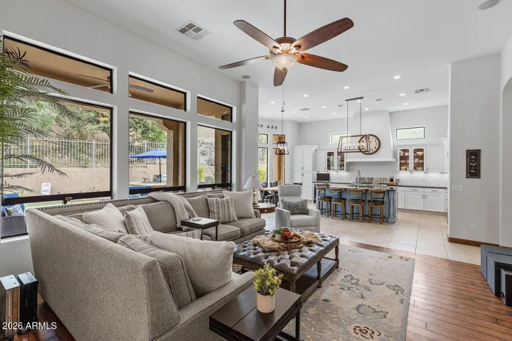 Overlooking the refreshing pool and patio leading to the Master Suite.