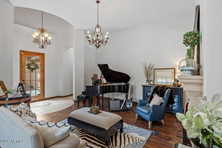 Formal living room with Beautiful wood tile flooring and Elegant lighting!