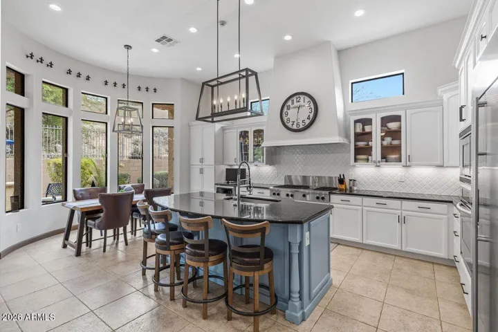 This Kitchen dining area is dramatic and overlooks the Breathtaking pool.