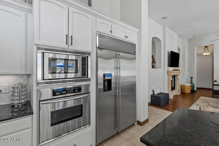 White soft close cabinets with roll-out drawers for serious cooking, and elegant enterttaining.