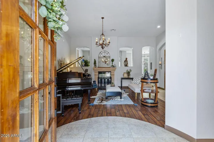 Greets you with soaring ceilings, and Romantic two way Stone Fireplace.