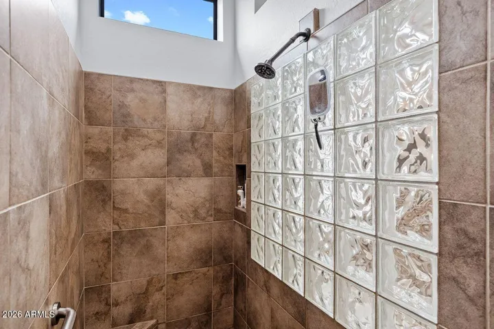 Spacious tiled Master walk in shower.