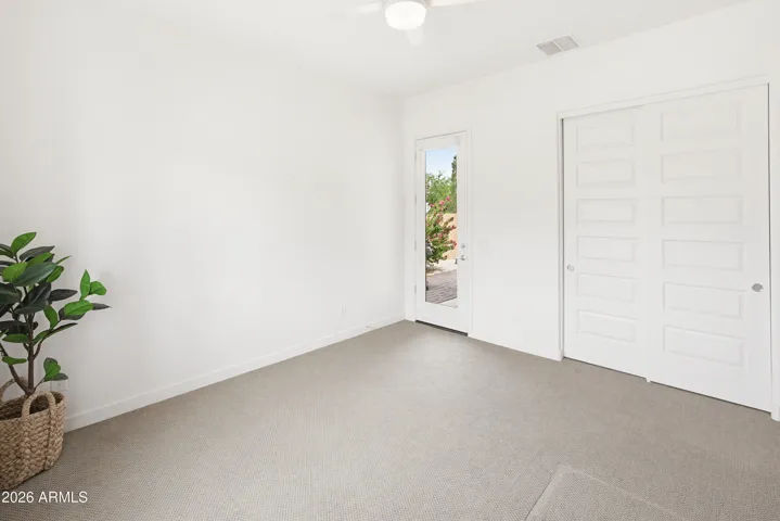 Bedroom 1 with private side yard access
