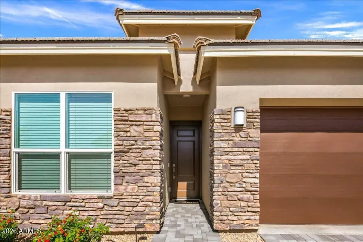 Bluebird model with stone accent work and a 2 car garage