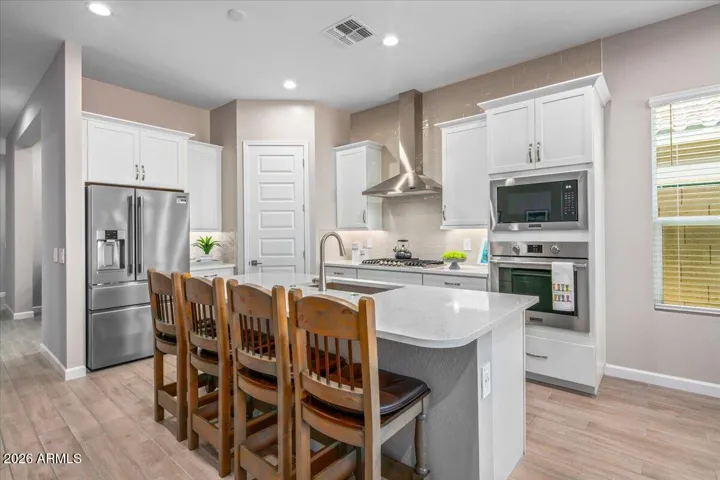 Soft close cabinetry with crown molding. Walk-in pantry.