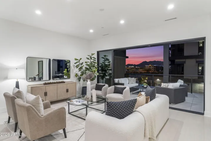 Open great room with sliding doors leading to the 39' private terrace.