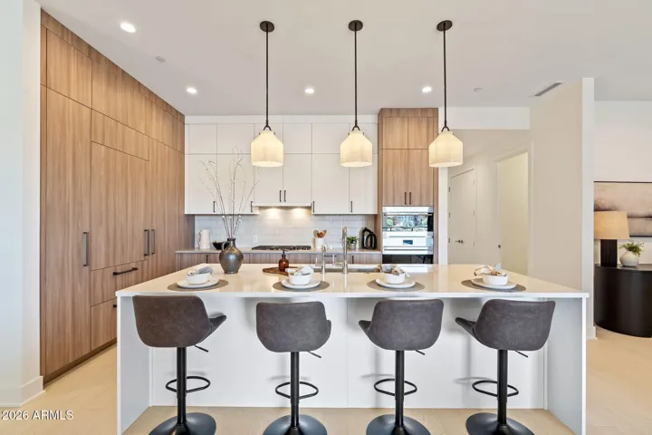 Italian cabinetry, Sub-Zero & Wolf appliances, and quartz island.