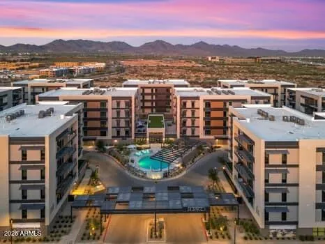 Aerial perspective showcasing the community layout set against the stunning backdrop of the McDowell Mountains and surrounding desert landscape.