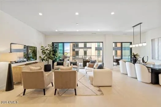 Expansive open-concept design flows from the kitchen into the great room and out to a private covered terrace—perfectly curated for entertaining or quiet relaxation.