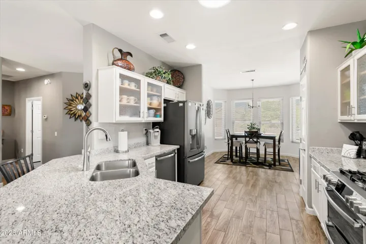 Cheery, light and bright kitchen looking to the nook.