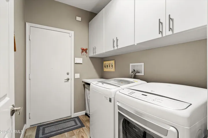 Newer washer and dryer, the cabinets have been updated and there is a built in folding shelf