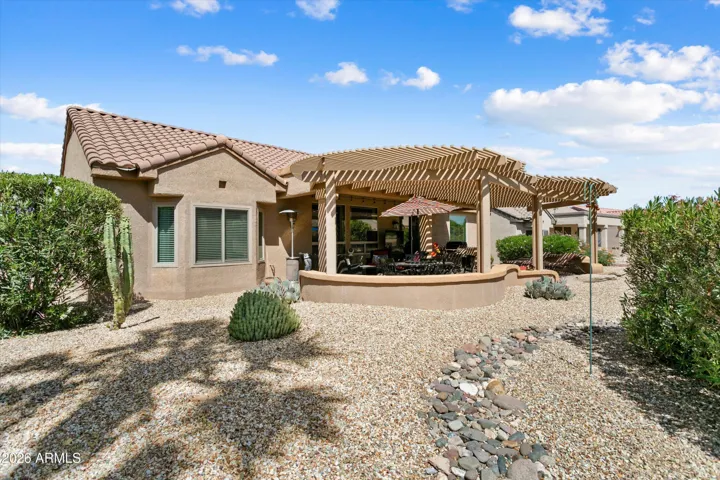 The mature landscaping gives the backyard a serene privacy.