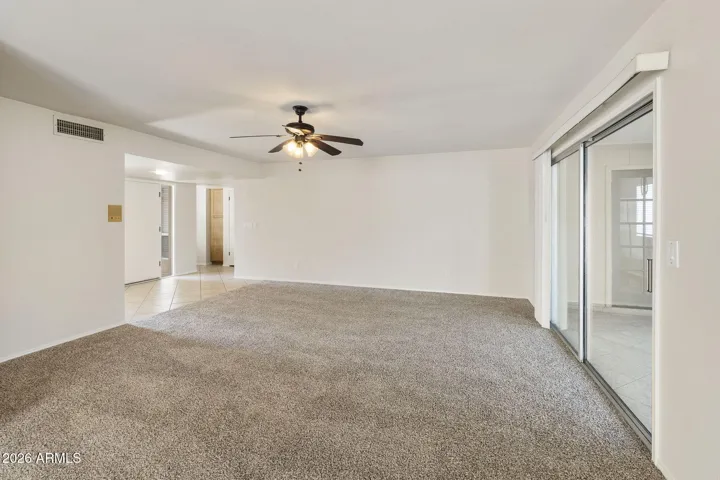 Family Room with slider to Arizona Room- Entry to home on the left.