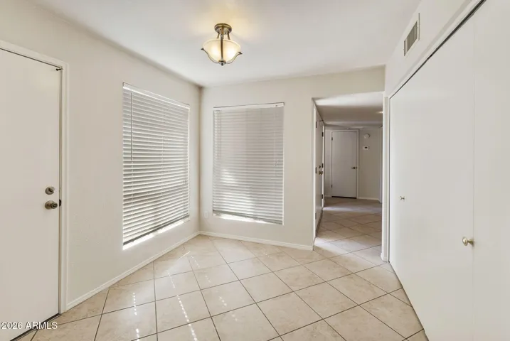 Door to Garage and Closet to Laundry Room