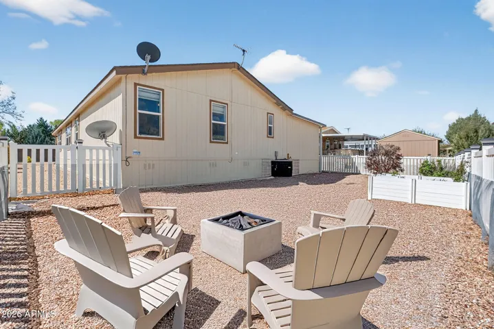 Backyard is fenced in and connect to covered Carport area.
