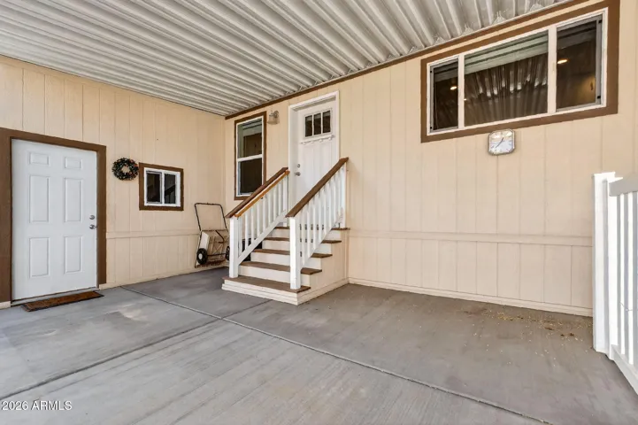 Door at top of stairs is Bedroom 2 and Door at ground level is to Shed