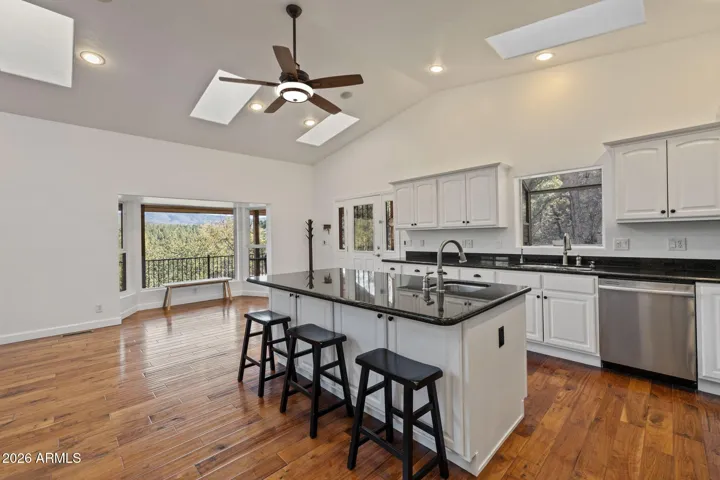 Complete with granite counter tops, large Island and Stainless Steel Appliances