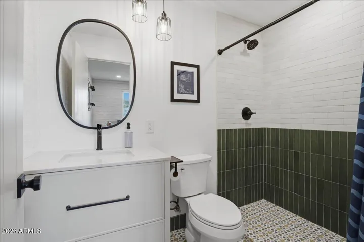 Each bathroom with custom tile work.