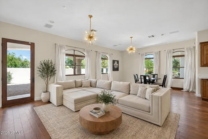 The attached casita features a generous living area, full kitchen and dining area with a separate bedroom and bath. Perfect for multi generational living, guest quarters or income generating potential. **enhanced virtual staging**