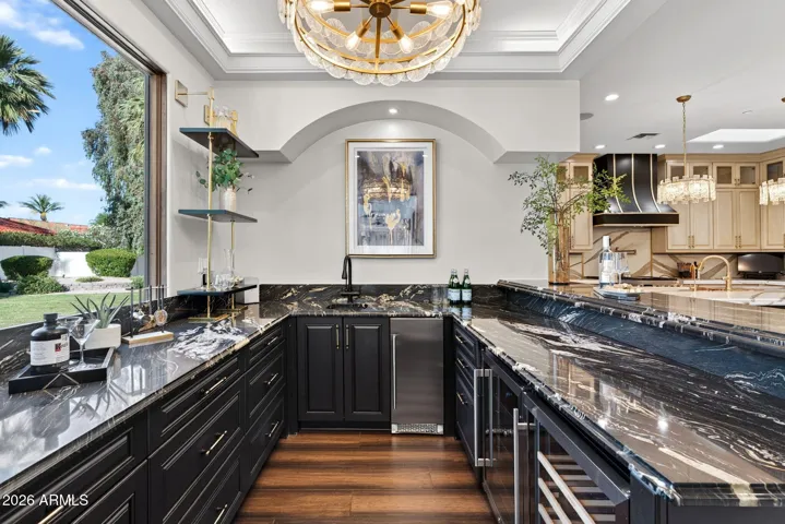 Belly up to your own custom bar. Decked out with wine storage, ice machine and beverage refrigerators.