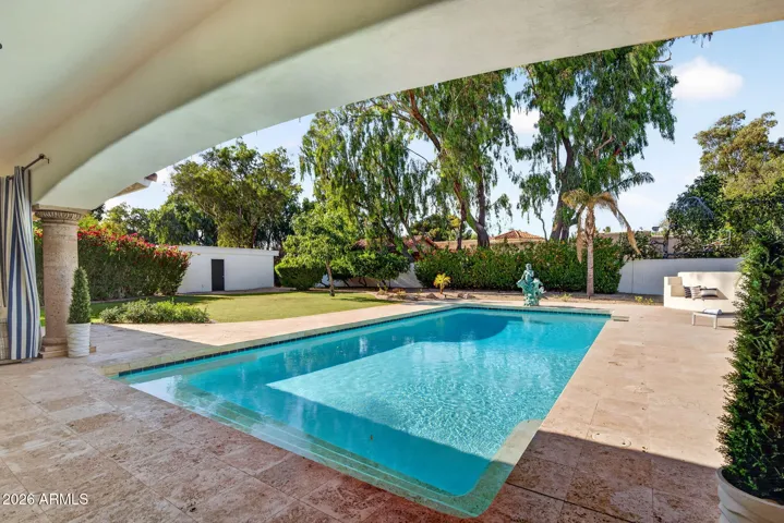 This beautiful pool is the centerpiece of the sprawling backyard.