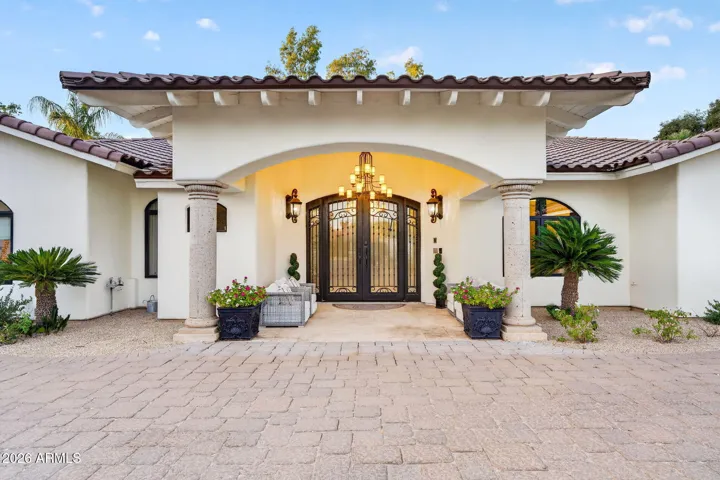 Scale and presence define the entryway to this beautiful home.