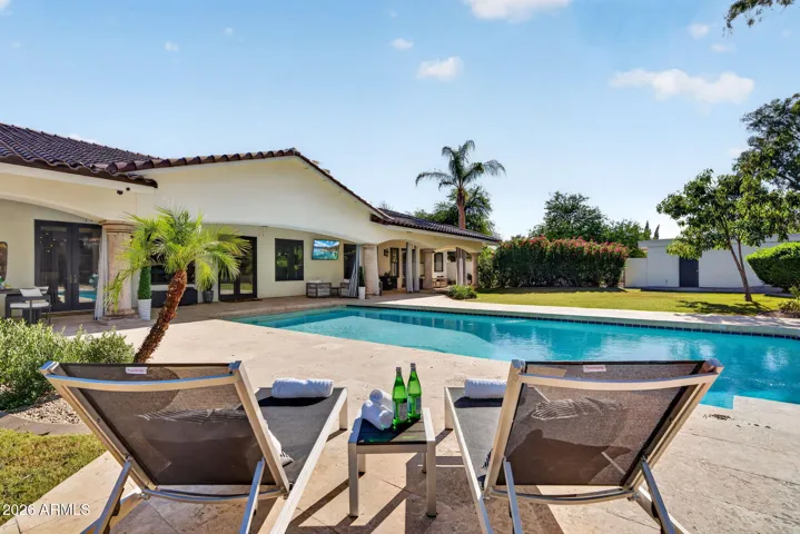 Welcome to your private oasis complete with large covered patio and sparkling pool.