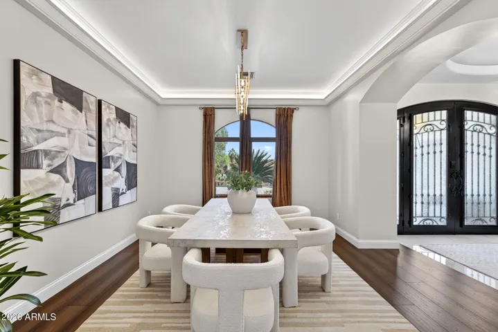 A formal dining room welcomes you with hardwood floors and beautiful cove lighted ceilings.