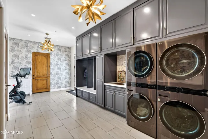 Amazing amounts of storage space are featured in this double stack laundry room.