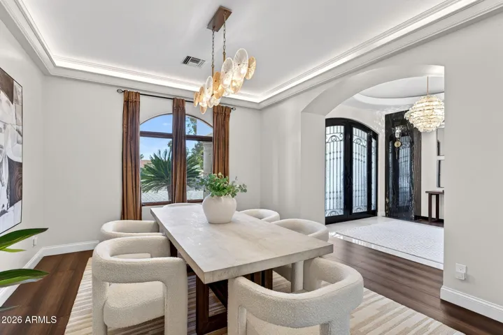 Arches and details define this lovely dining space.