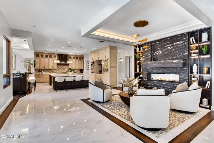 The custom stone clad fireplace invites you to take a seat and enjoy the glow.