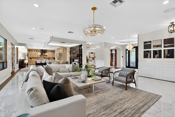The great room invites you to explore it's grand living areas that include unique vignettes for maximum enjoyment.