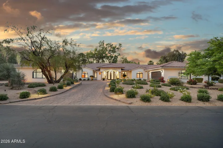 The home wraps around a grand entry space with loads of guest parking.