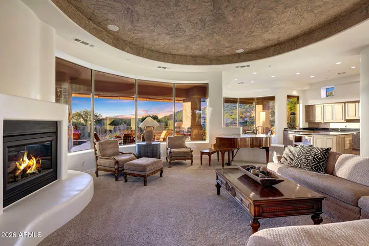 Gas fireplace framed by abundant natural light and scenic VIEWS!