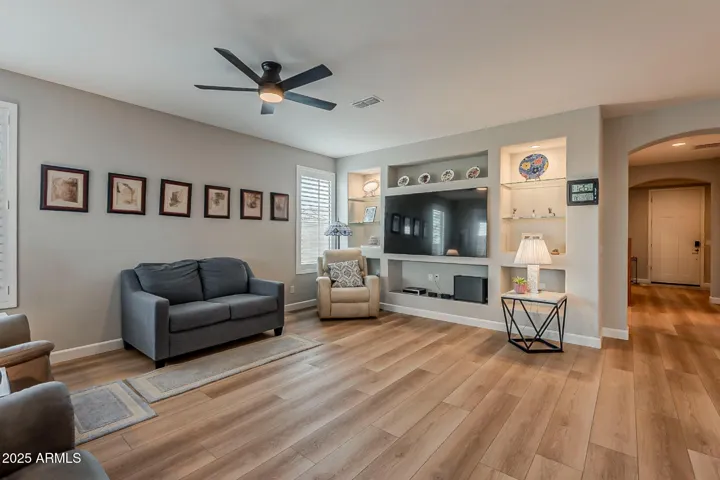 Audio visual built in with drywall niches, glass shelves, dimmable recessed can lights.