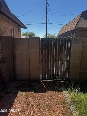 Side gate on east side of property to access back yard