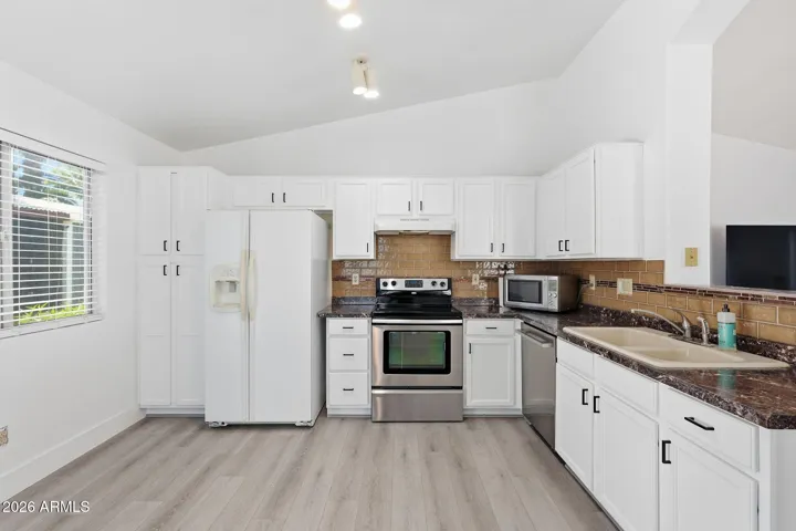 Kitchen - freshly painted cupboards and hardware