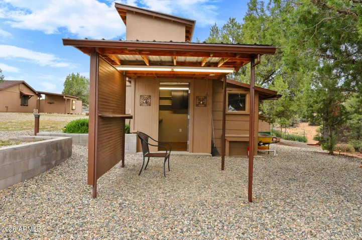 2 Story Shop with Patio. Has power, top level used as a playhouse.