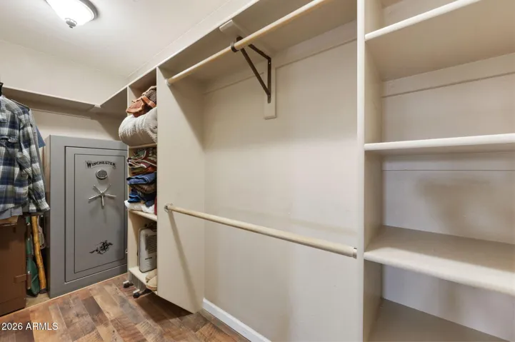 Walk In Closet has Built In Shelving.