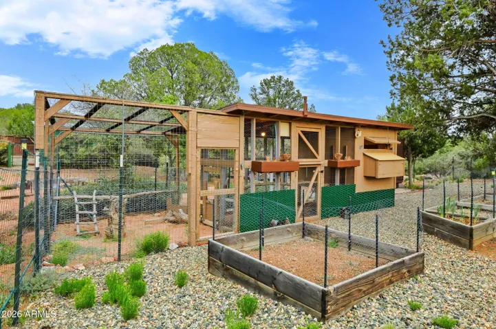 Chicken coop has power, water, 2 runs.