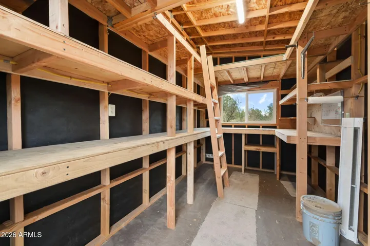 This shop has 14' ceilings, and a loft, and power.