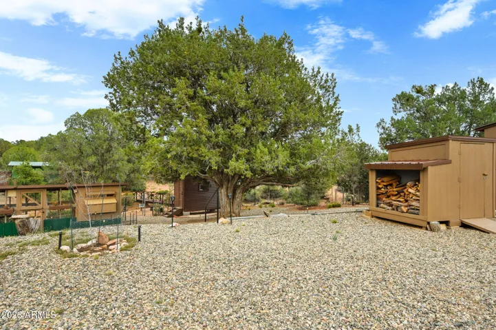Mature Junipers, the grounds are enhanced with Low Voltage Lighting.