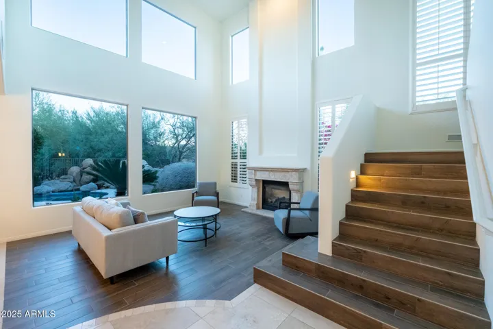 Designed for effortless living, this home offers four bedrooms, three ensuite baths, and 3,233 square feet of natural light–filled space.