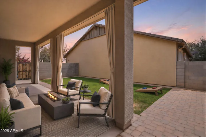 Backyard and extended covered patio. Virtually staged.