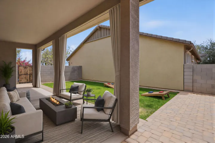 Backyard and extended covered patio, extended pavers, real grass, sprinkler system (virtually staged)