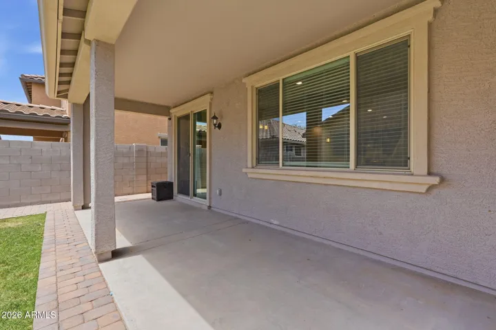 Backyard and extended covered patio, extended pavers, real grass, sprinkler system