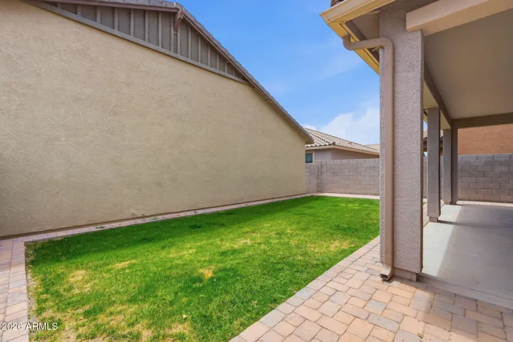 Backyard and extended covered patio, extended pavers, real grass, sprinkler system