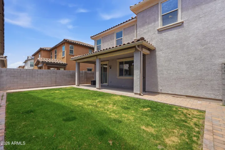Backyard and extended covered patio, extended pavers, real grass, sprinkler system