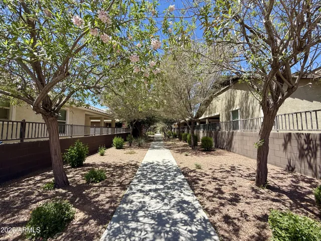 Walking path near the home leading to the community pool and playground